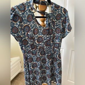 Multicolored patterned dress with V back.